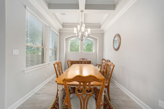 dining space featuring beam ceiling, crown molding, light hardwood / wood-style floors, and coffered ceiling