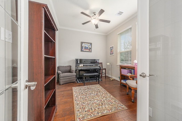 office area with crown molding, dark hardwood / wood-style flooring, ceiling fan, and french doors