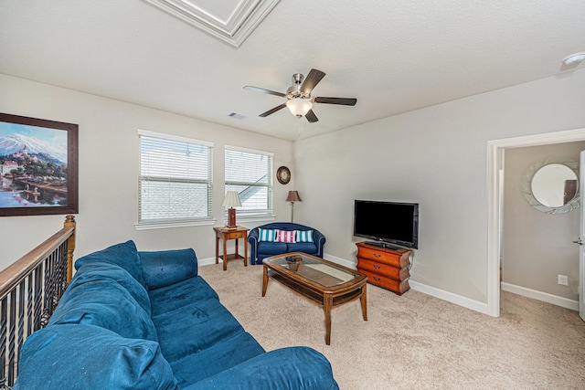 living room with light carpet, a textured ceiling, and ceiling fan