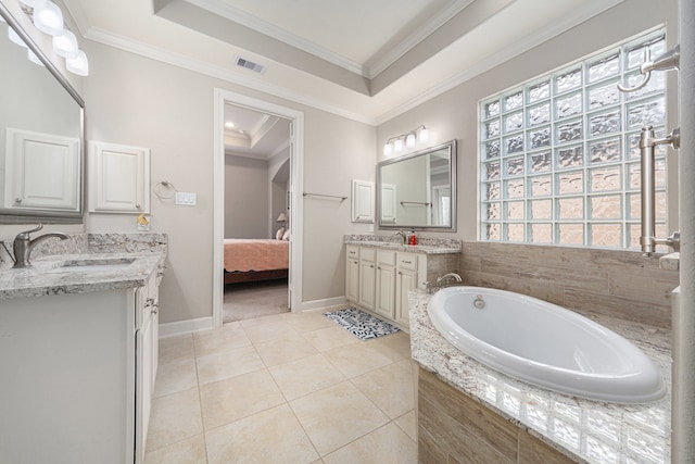 bathroom featuring a raised ceiling, tile patterned flooring, tiled bath, vanity, and ornamental molding