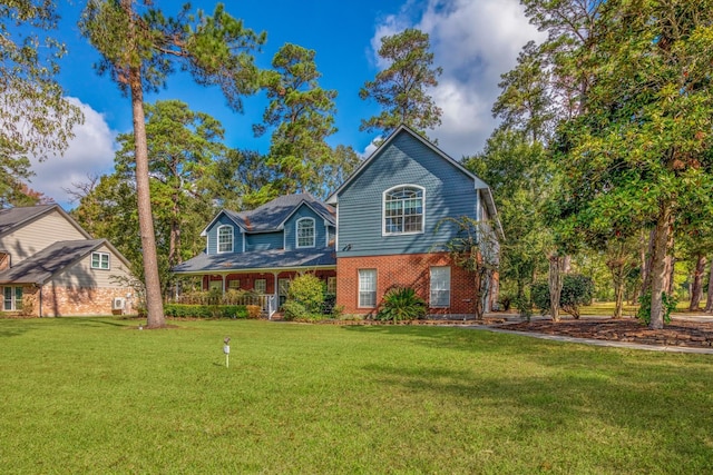 view of front of property featuring a porch and a front yard