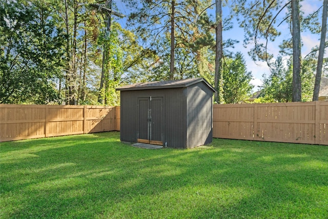 view of outdoor structure featuring a lawn