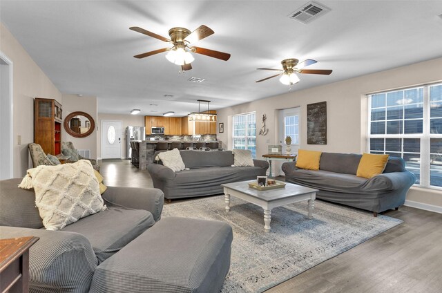 161 Cayman St, Point Blank, TX 77364 - living room featuring a ceiling fan, light wood-style floors, and baseboards