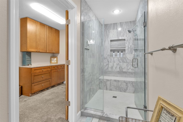 bathroom with a shower with door