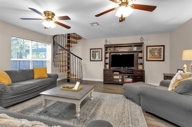 living room featuring ceiling fan and hardwood / wood-style flooring