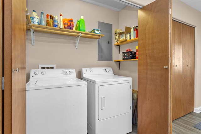 161 Cayman St, Point Blank, TX 77364 - laundry area featuring washer and dryer, light wood-style flooring, and electric panel