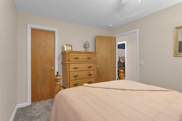 bedroom featuring ceiling fan and light carpet