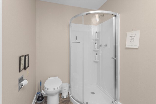 161 Cayman St, Point Blank, TX 77364 - full bathroom featuring a shower stall, toilet, and baseboards