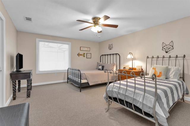 bedroom with ceiling fan and carpet floors