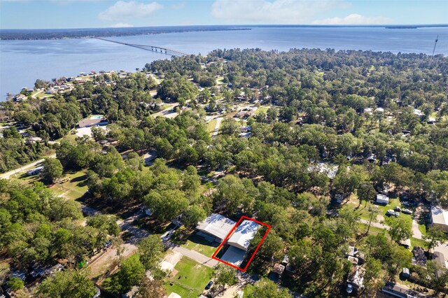161 Cayman St, Point Blank, TX 77364 - aerial view of property and surrounding area featuring property boundaries highlighted, a nearby body of water, and a notable bridge