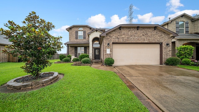 view of front of home with a front lawn and a garage