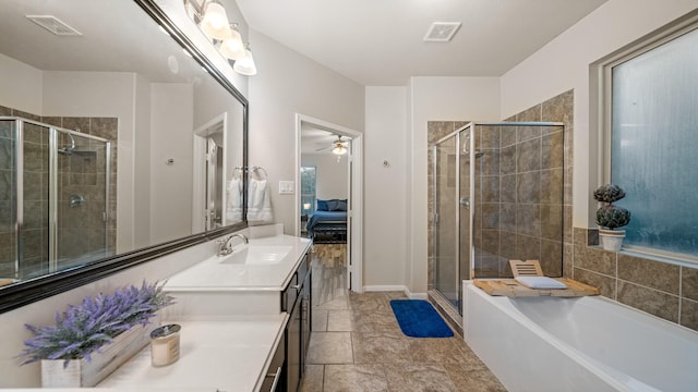 bathroom featuring ceiling fan, vanity, and shower with separate bathtub