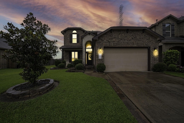 french country style house featuring a garage and a yard