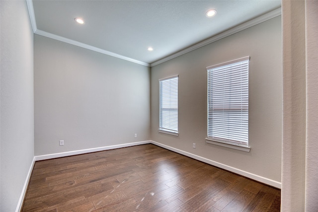 unfurnished room with wood-type flooring and crown molding