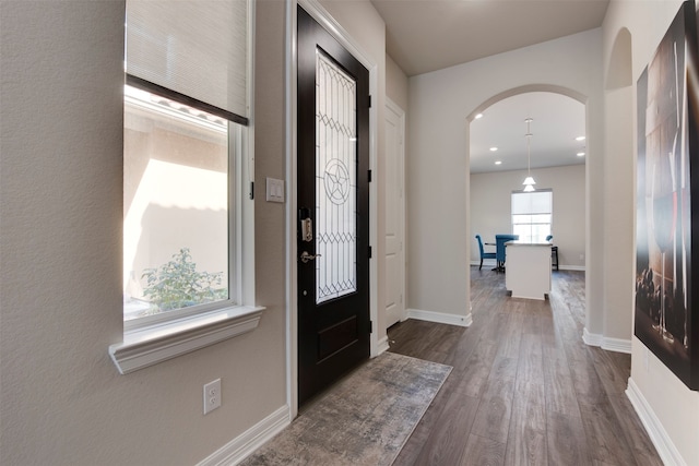 entryway with dark wood-type flooring