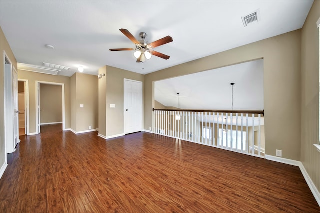 unfurnished room with ceiling fan and dark wood-type flooring