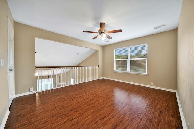 unfurnished room with ceiling fan and dark hardwood / wood-style flooring