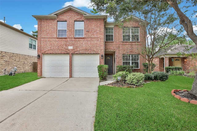 view of front of home with a front yard and a garage