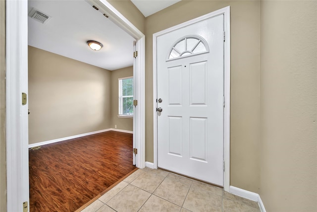 foyer entrance with light wood-type flooring