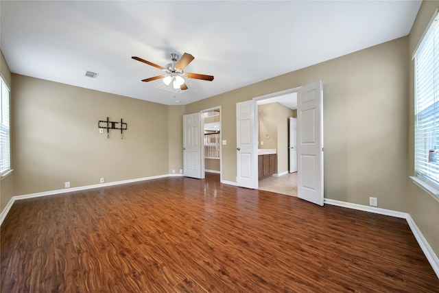 unfurnished room with wood-type flooring and ceiling fan