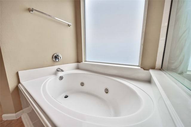 bathroom with tiled bath