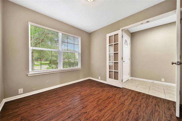 unfurnished room featuring wood-type flooring