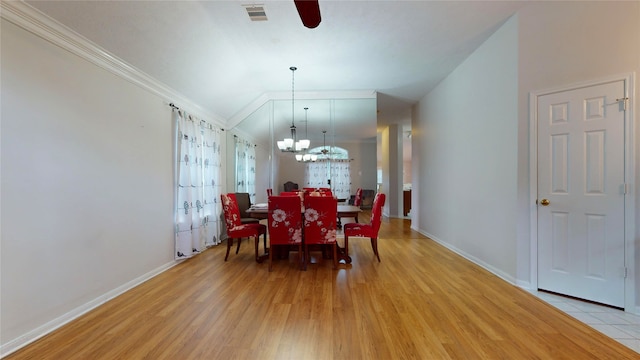 dining area featuring ceiling fan with notable chandelier, crown molding, and light hardwood / wood-style floors