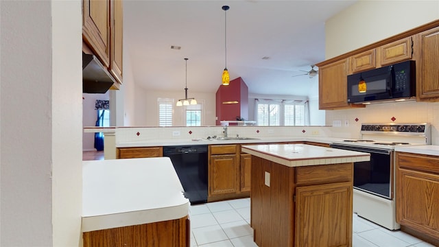 kitchen with kitchen peninsula, ceiling fan, black appliances, decorative light fixtures, and a kitchen island