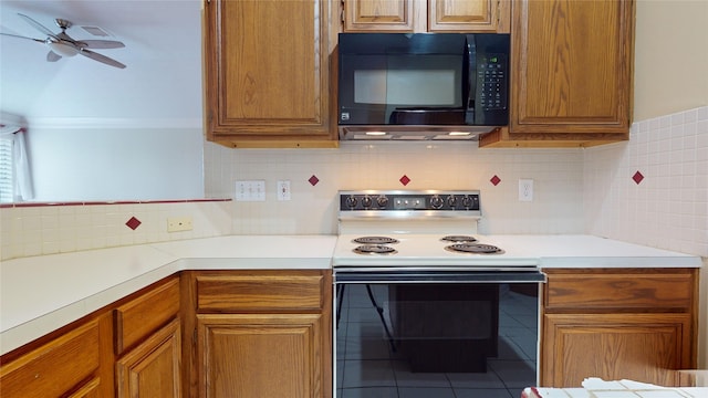 kitchen featuring tasteful backsplash, tile patterned floors, range with electric stovetop, and ceiling fan