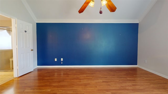 empty room featuring ornamental molding, ceiling fan, and wood-type flooring