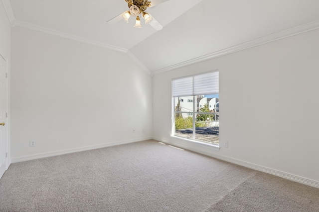 spare room featuring carpet flooring, crown molding, ceiling fan, and lofted ceiling