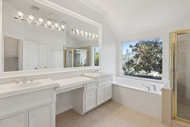 bathroom with independent shower and bath, a wealth of natural light, lofted ceiling, and tile patterned floors