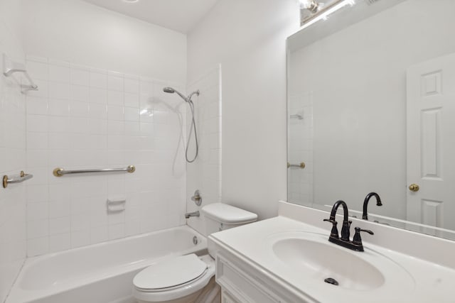 full bathroom featuring vanity, toilet, and tiled shower / bath combo