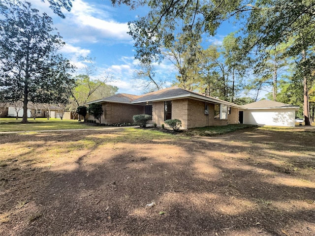 view of property exterior with a lawn