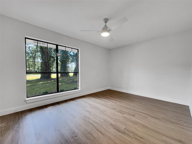 spare room featuring ceiling fan and light hardwood / wood-style floors