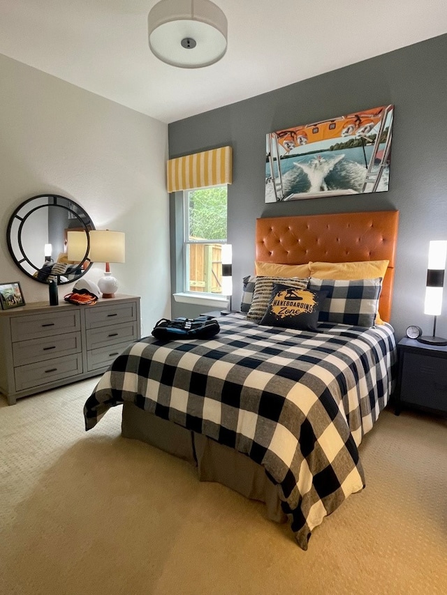 bedroom featuring light carpet