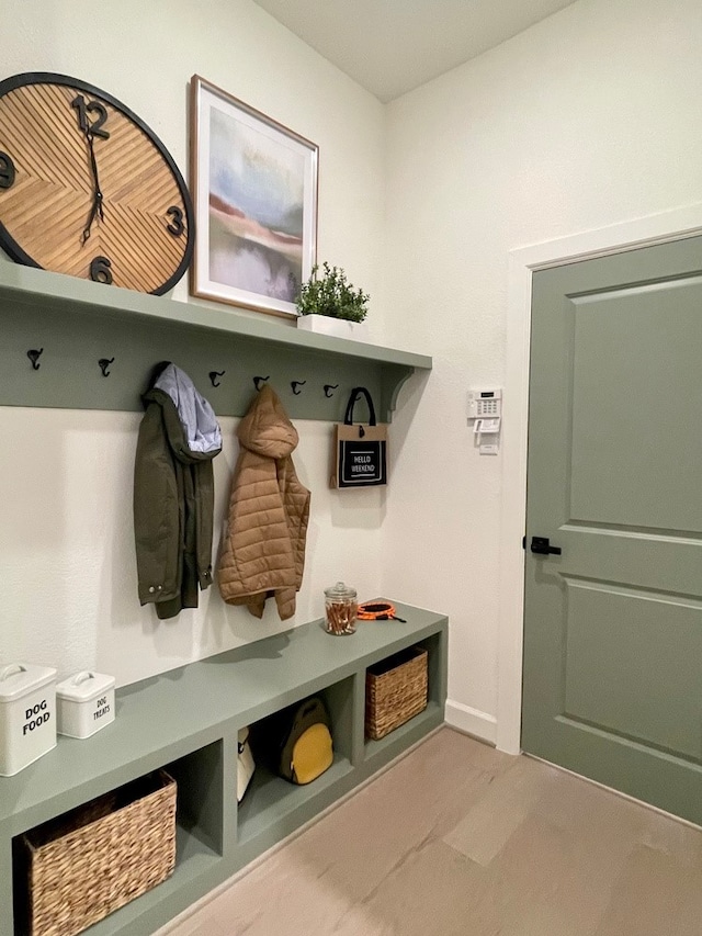 mudroom with light colored carpet