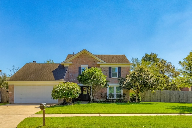 view of front facade featuring a front yard and a garage