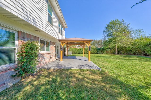 view of yard featuring a gazebo and a patio area