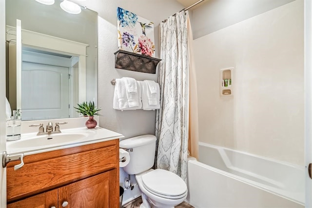 full bathroom featuring vanity, shower / tub combo, and toilet