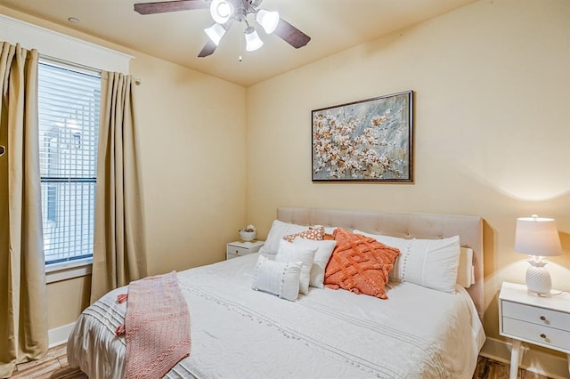 bedroom featuring ceiling fan and hardwood / wood-style flooring