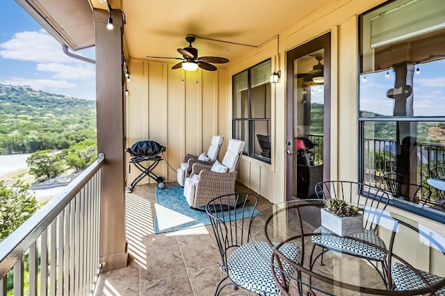 balcony featuring ceiling fan