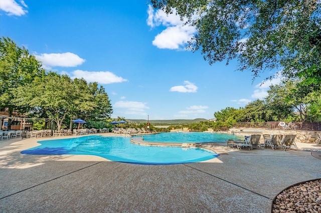 view of swimming pool featuring a patio area