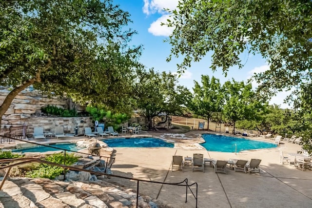 view of pool featuring a patio