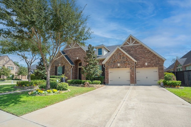 view of front of house with a front yard and a garage