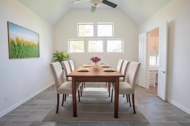 dining room featuring ceiling fan and vaulted ceiling