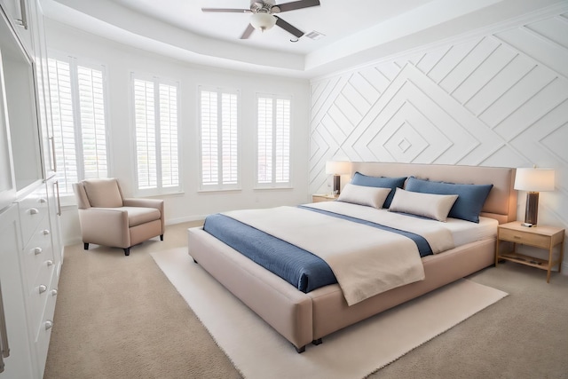 bedroom featuring light colored carpet and ceiling fan