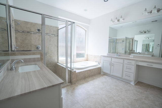 bathroom with vanity, independent shower and bath, and tile patterned flooring