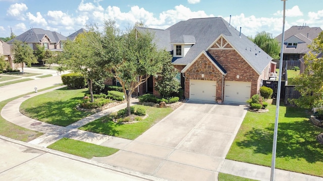 view of front of house featuring a front lawn and a garage