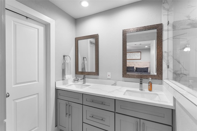 11207 Wood Lodge Dr, Houston, TX 77077 - ensuite bathroom with double vanity and a marble finish shower